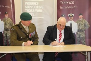 Jim Wright, Director, Wrights Logistic Service, signing the Armed Forces Covenant