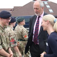 A cadet speaks to guests at the event