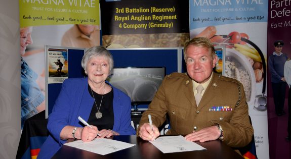 Chair Doreen Stephenson and Major Mitch Pegg  signing a covenant