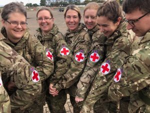 Members of 212 Field Hospital show their red cross arm bands