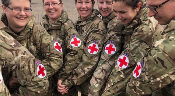 Members of 212 Field Hospital show their red cross arm bands
