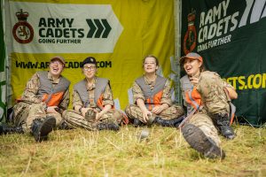 Four Army Cadets sitting on the grass