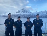 The four Reservists mobilised with Norway's scenary in background.