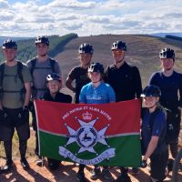 East Midlands University Officers Training Corps with flag at top of Aviemore