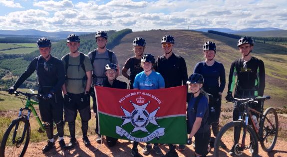 East Midlands University Officers Training Corps with flag at top of Aviemore