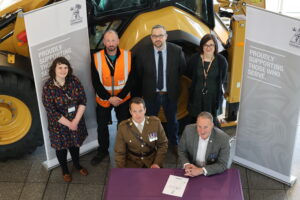 Kirstie (far left) helped Caterpillar become the 1,000 organisation to sign the AFC in the East Midlands.