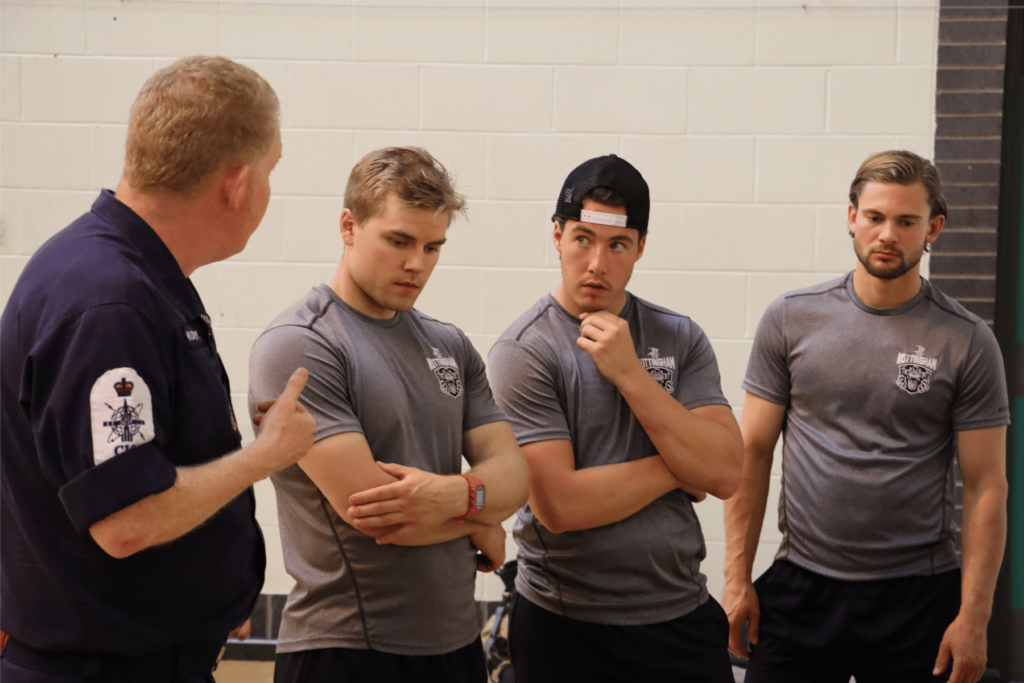 The Nottingham Panthers players learn about fire fighting equipment.