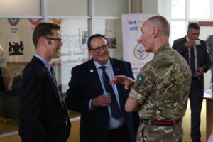 A Reservist chats with representatives from Employer Recognition Award holders Fred Sherwood Group and Pall-Ex