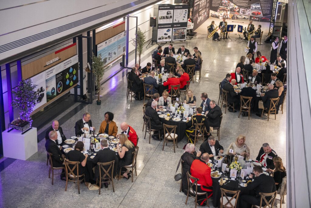 Aerial view of the Gold Employer Recognition Scheme Awards venue showing recipients and guests seated at round tables enjoying dinner.